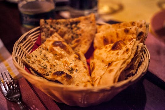 Close-up of traditional Indian flatbreads in a basket, perfect for a delicious meal.