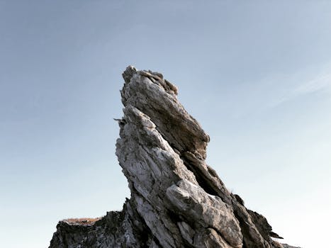 Imposing rock formation set against a clear sky in Kurma, Irkutsk Oblast, Russia.