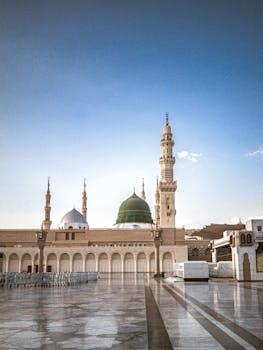 The Prophet's Mosque in Madinah with its iconic green dome, a significant Islamic landmark.